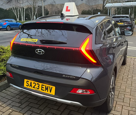 car with cert2pass logo and telephone number